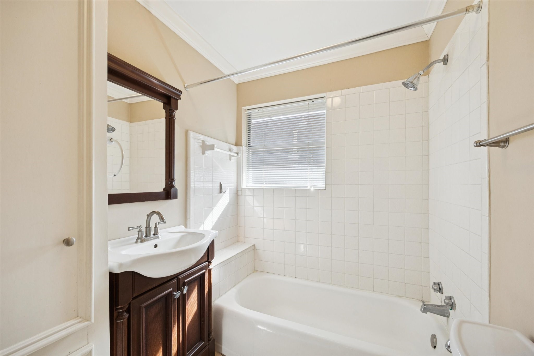 4207 Drake Street Houston, TX 77005 - Photo 11 of 24 a bathroom with a bathtub shower sink vanity and mirror