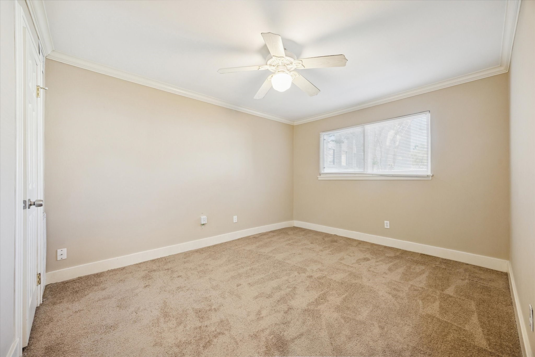 4207 Drake Street Houston, TX 77005 - Photo 12 of 24 an empty room with chandelier fan and windows
