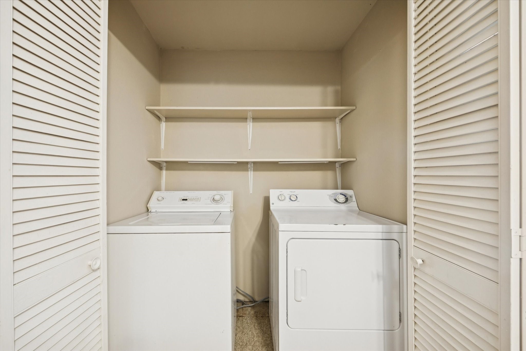 4207 Drake Street Houston, TX 77005 - Photo 14 of 24 a utility room with dryer and washer