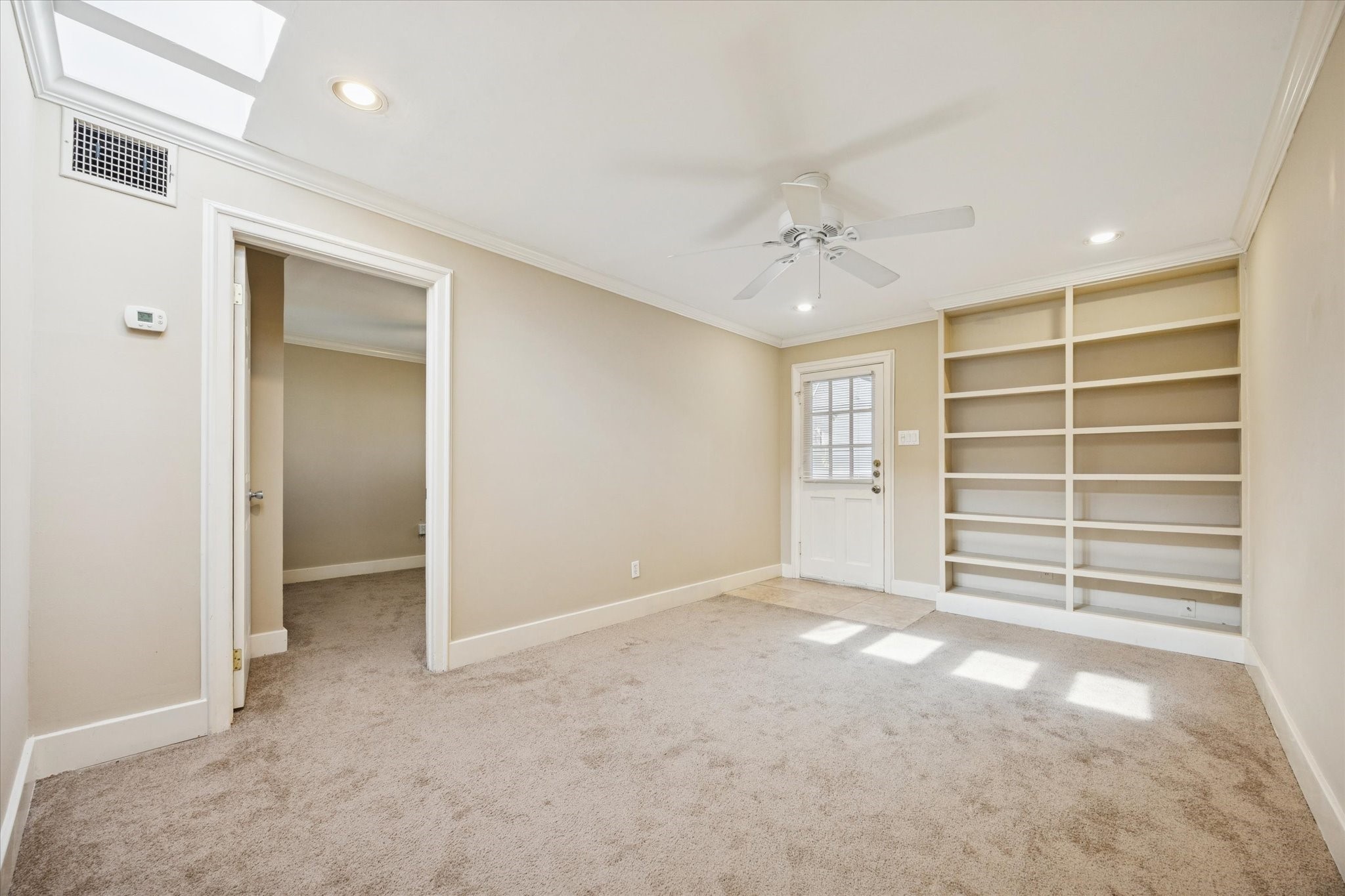 4207 Drake Street Houston, TX 77005 - Photo 6 of 24 a view of an empty room with a window