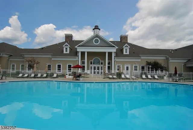 a view of living room with furniture and chandelier
