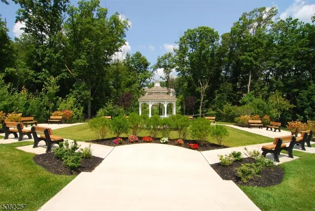 a view of a house with swimming pool and yard