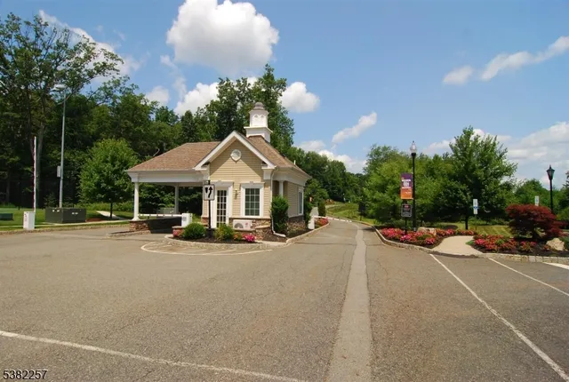 a view of a parked cars in front of a house