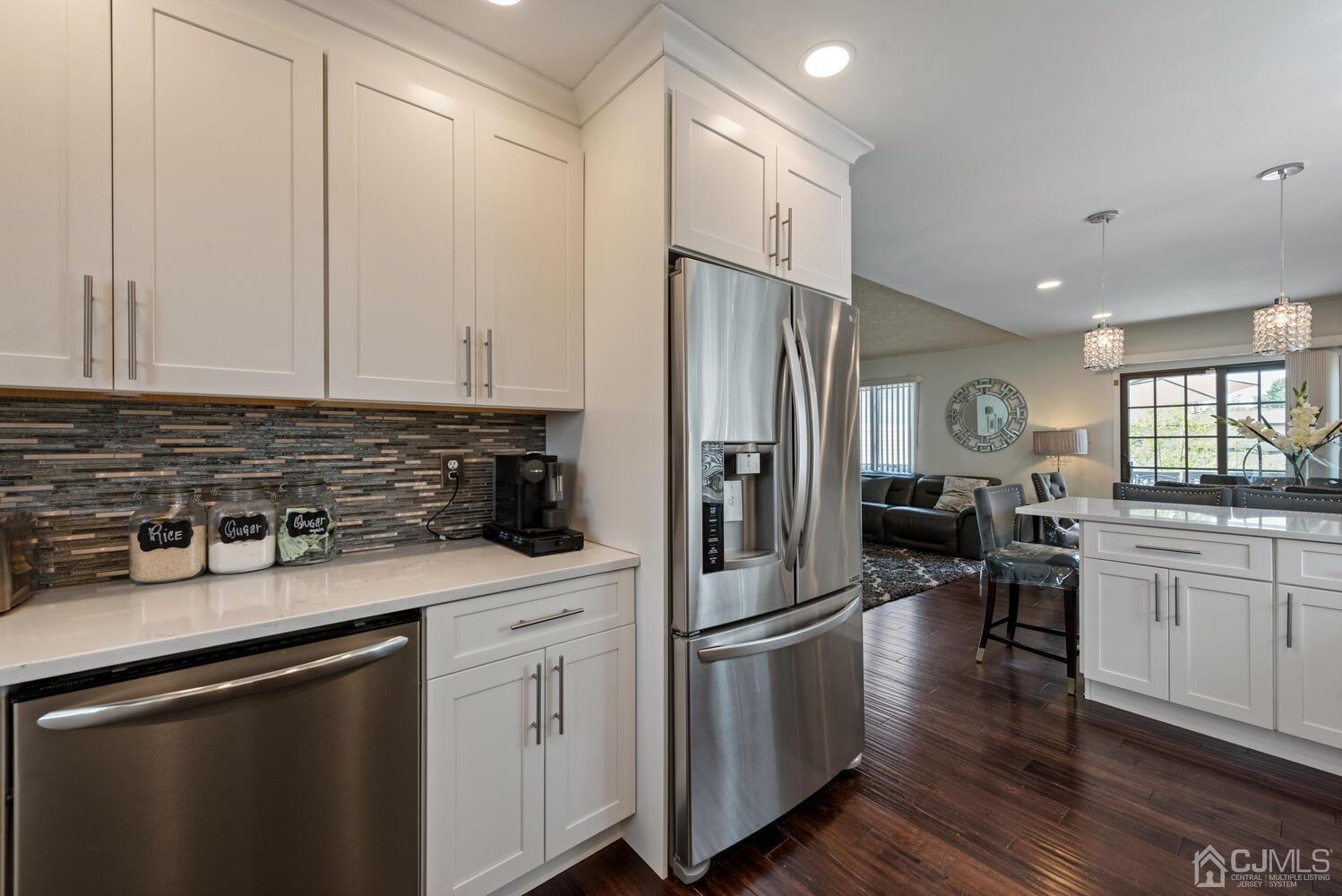 73 Appletree Road Howell, NJ 07731 - Photo 14 of 43 a kitchen with white cabinets and appliances