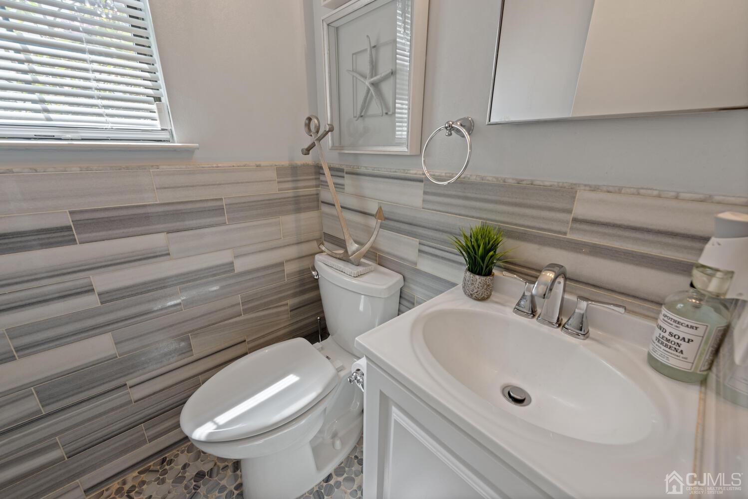 73 Appletree Road Howell, NJ 07731 - Photo 23 of 43 a bathroom with a sink and toilet