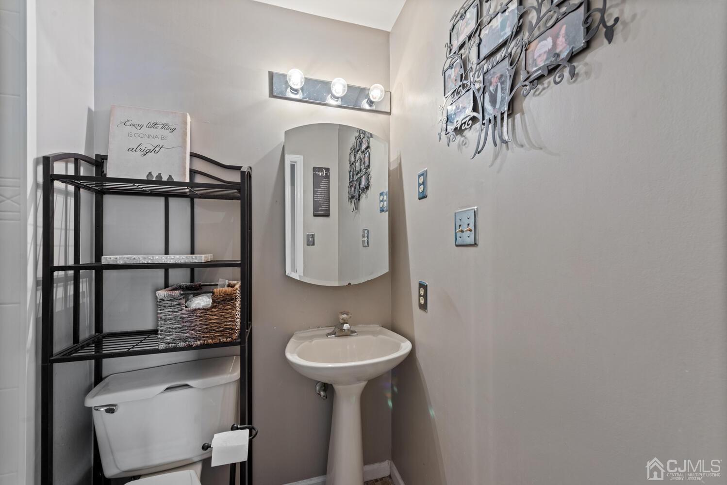 73 Appletree Road Howell, NJ 07731 - Photo 24 of 43 a bathroom with a sink a toilet and mirror