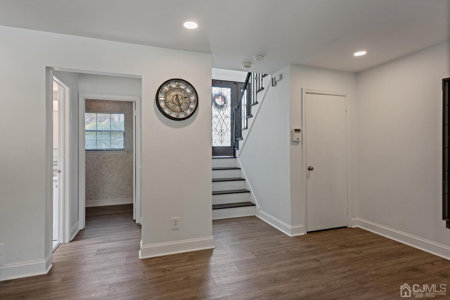 73 Appletree Road Howell, NJ 07731 - Photo 25 of 43 a view of a hallway with entryway with wooden floor