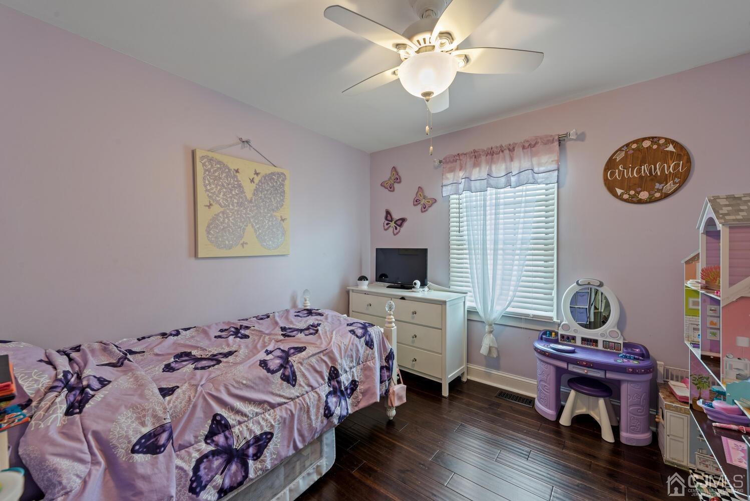 73 Appletree Road Howell, NJ 07731 - Photo 26 of 43 a bedroom with a bed and a chandelier