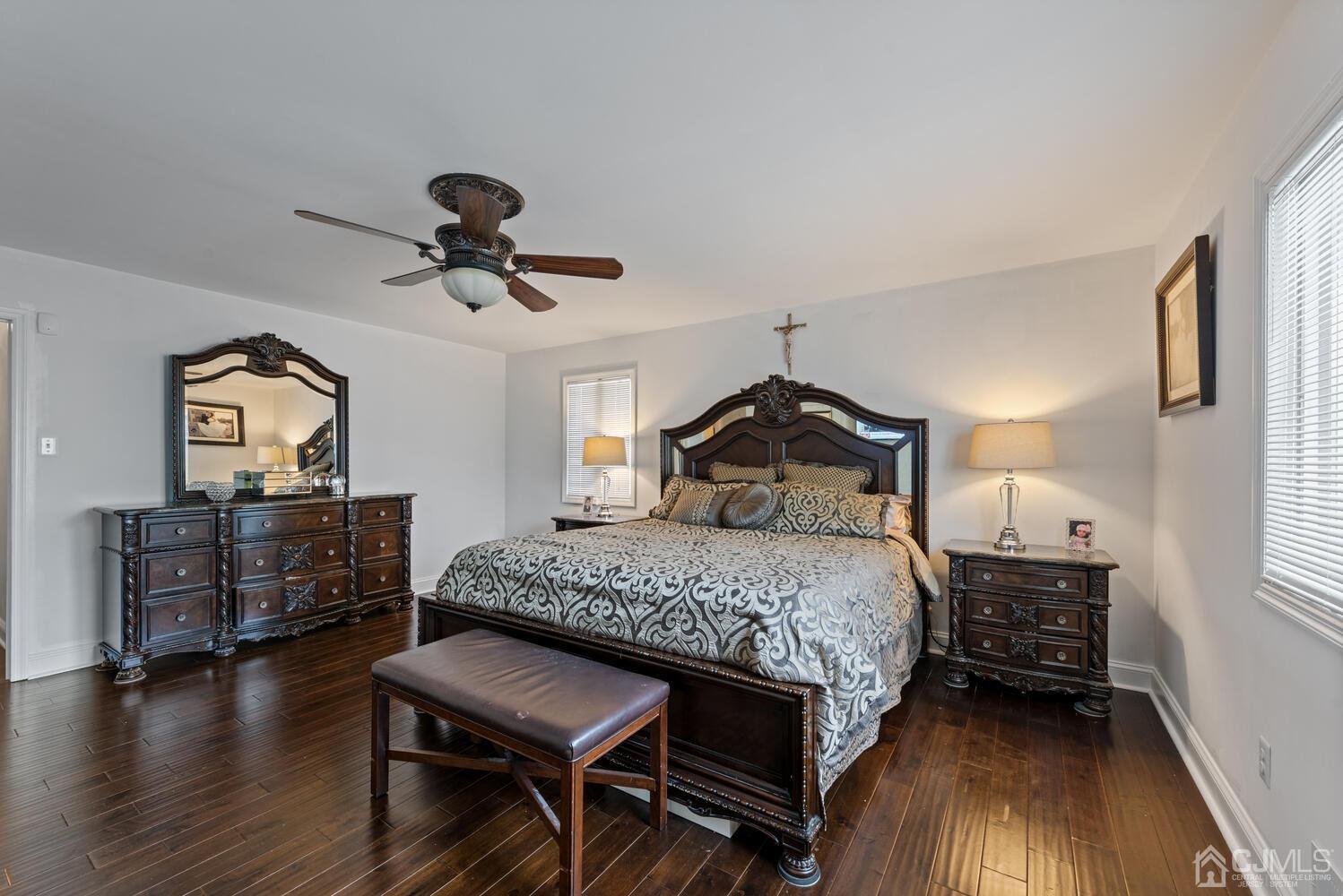 73 Appletree Road Howell, NJ 07731 - Photo 30 of 43 a bedroom with a bed a dresser and wooden floor