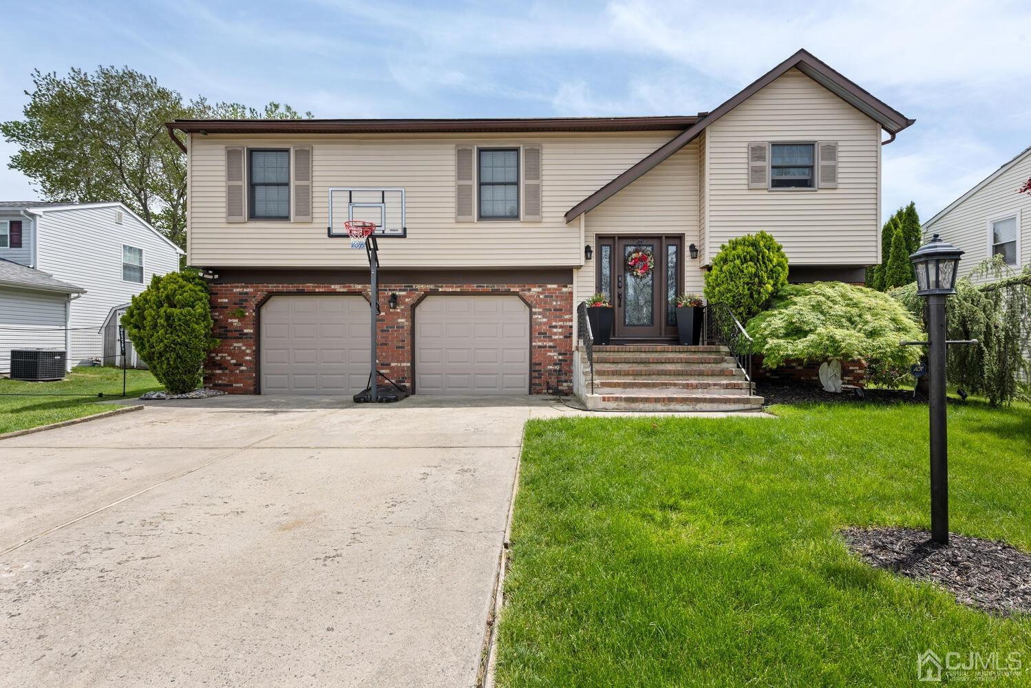 73 Appletree Road Howell, NJ 07731 - Photo 3 of 43 a front view of house with yard and green space