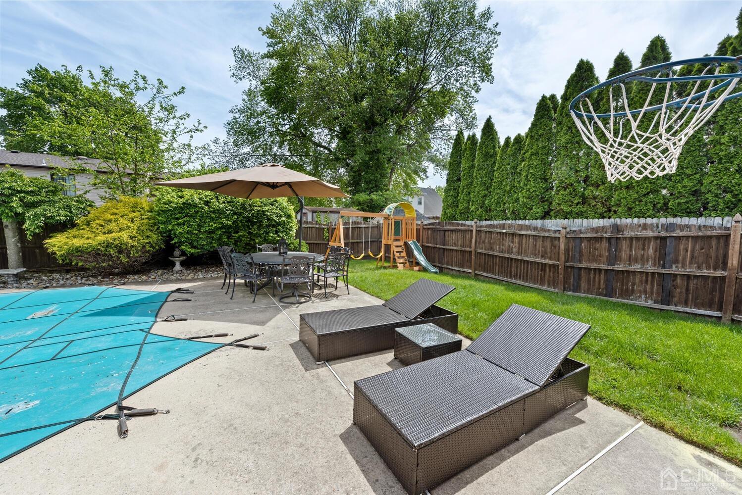 73 Appletree Road Howell, NJ 07731 - Photo 33 of 43 an outdoor sitting area with furniture and garden
