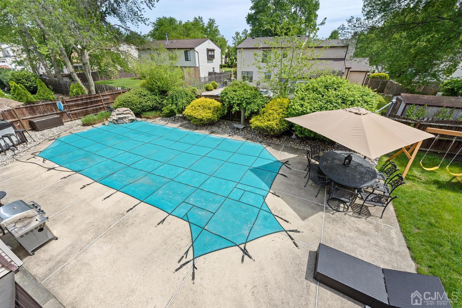 73 Appletree Road Howell, NJ 07731 - Photo 38 of 43 a view of a backyard with sitting area