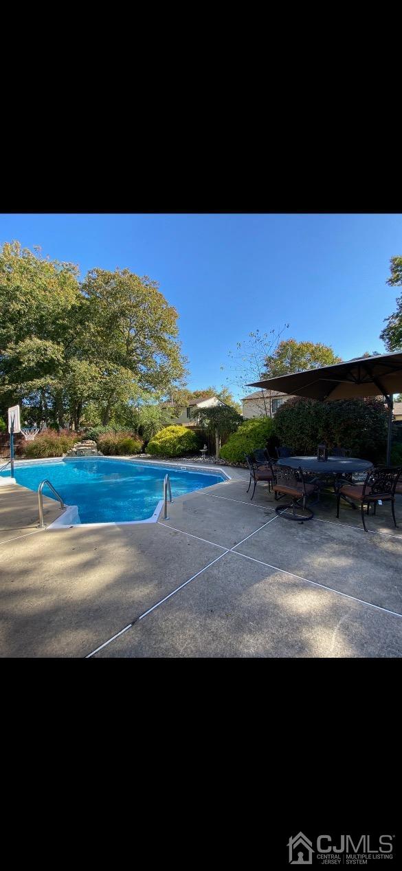 73 Appletree Road Howell, NJ 07731 - Photo 41 of 43 a view of a yard with furniture