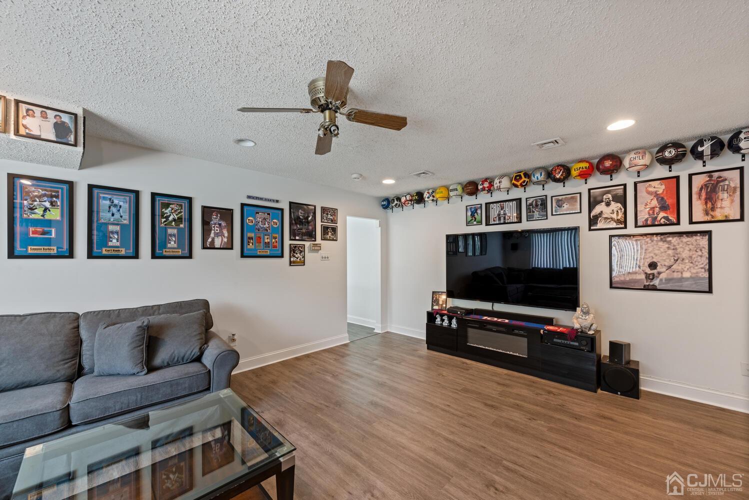 73 Appletree Road Howell, NJ 07731 - Photo 9 of 43 a living room with furniture and a flat screen tv