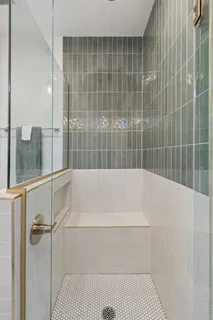 a bathroom with a bathtub and a shower