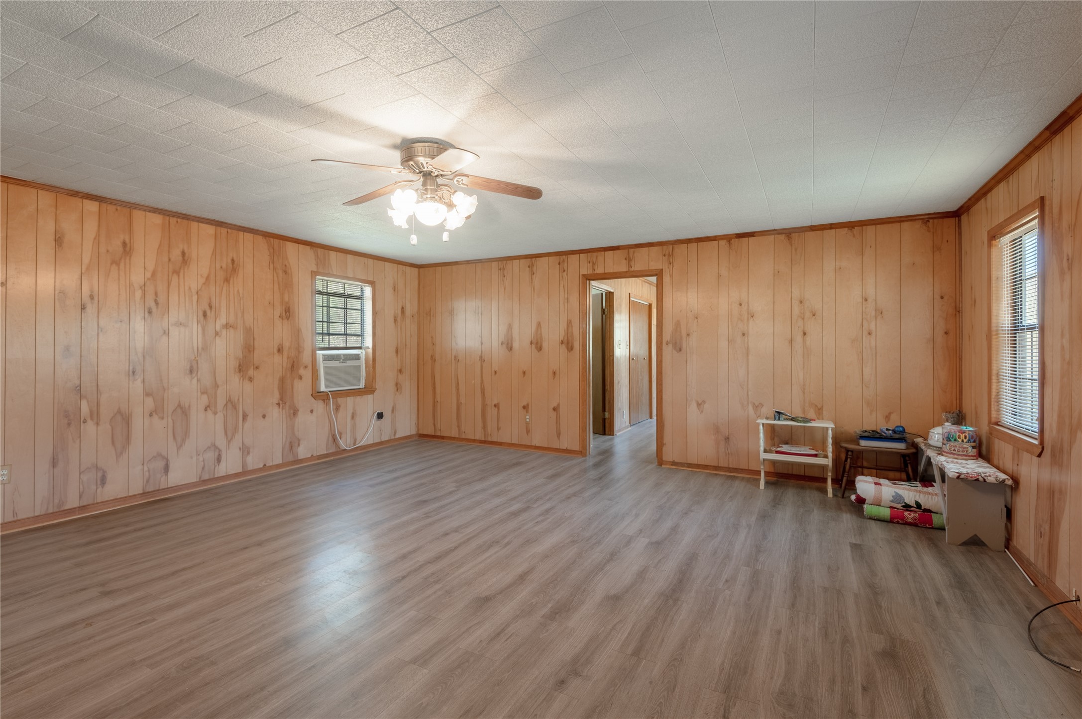 2792 Highway 287 Groveton, TX 75845 - Photo 3 of 25 an empty room with wooden floor and windows