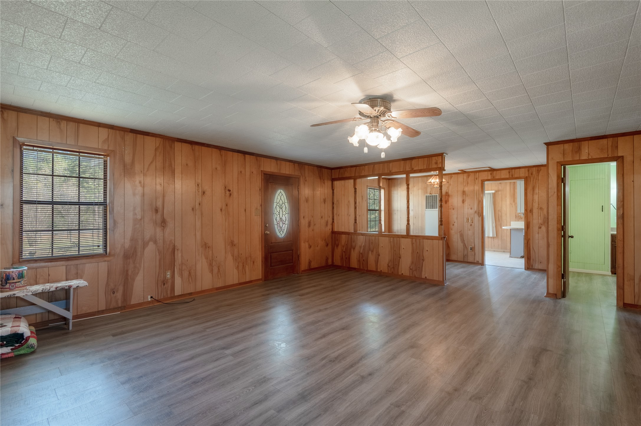 2792 Highway 287 Groveton, TX 75845 - Photo 4 of 25 a view of an empty room with a window and wooden floor