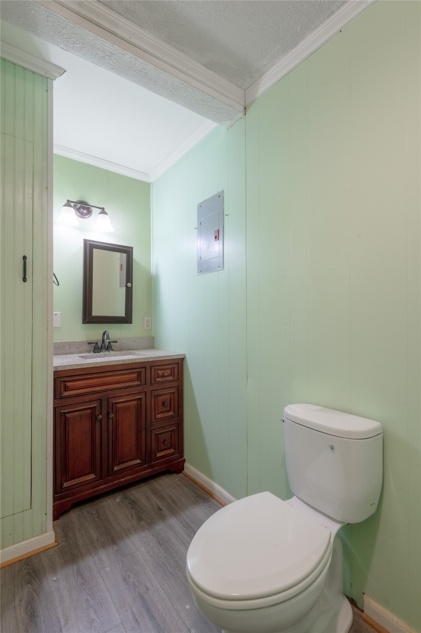 2792 Highway 287 Groveton, TX 75845 - Photo 10 of 25 a bathroom with a toilet a sink and mirror