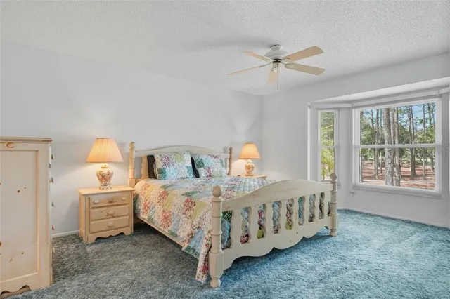 a bed room with a bed and a chandelier