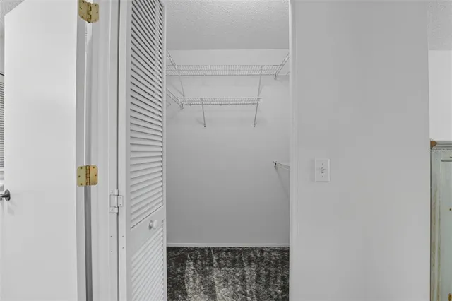 a bathroom with a shower sink and mirror