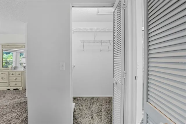 a spacious bathroom with a double vanity sink and mirror