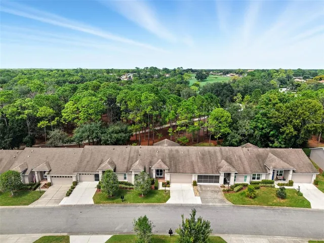 an aerial view of a house with sitting area