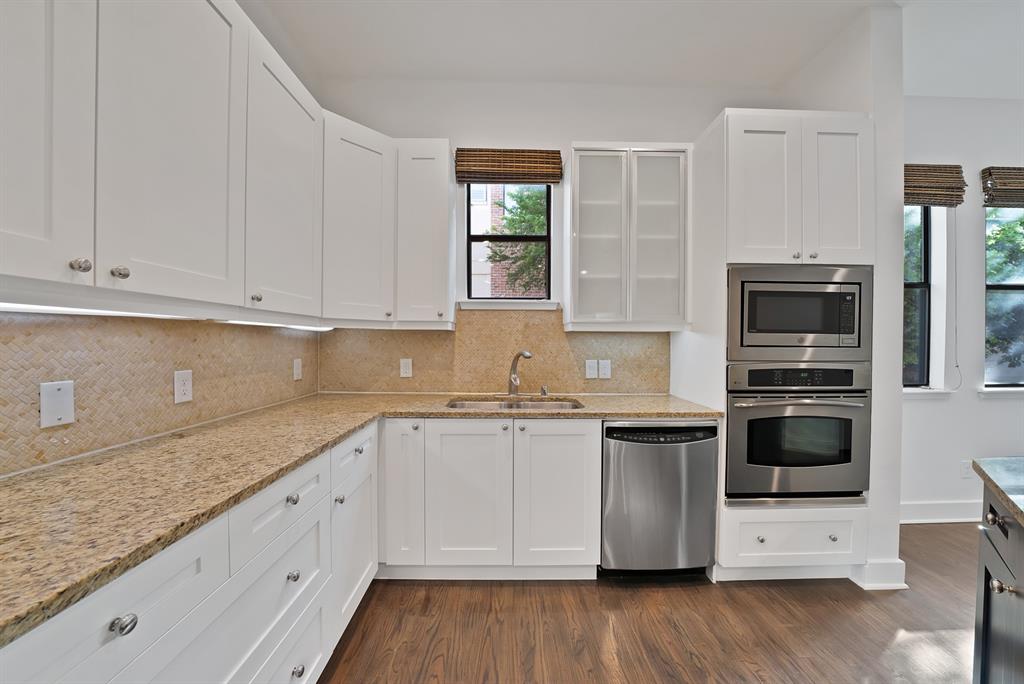 2420 Hugo Street, Unit 3 Dallas, TX 75204 - Photo 11 of 36 a kitchen with stainless steel appliances granite countertop a stove a sink and a microwave