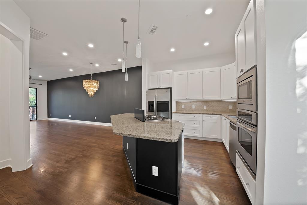 2420 Hugo Street, Unit 3 Dallas, TX 75204 - Photo 14 of 36 a kitchen with a sink stainless steel appliances and cabinets