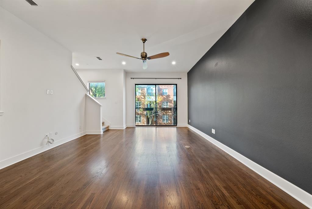 2420 Hugo Street, Unit 3 Dallas, TX 75204 - Photo 17 of 36 an empty room with wooden floor and windows