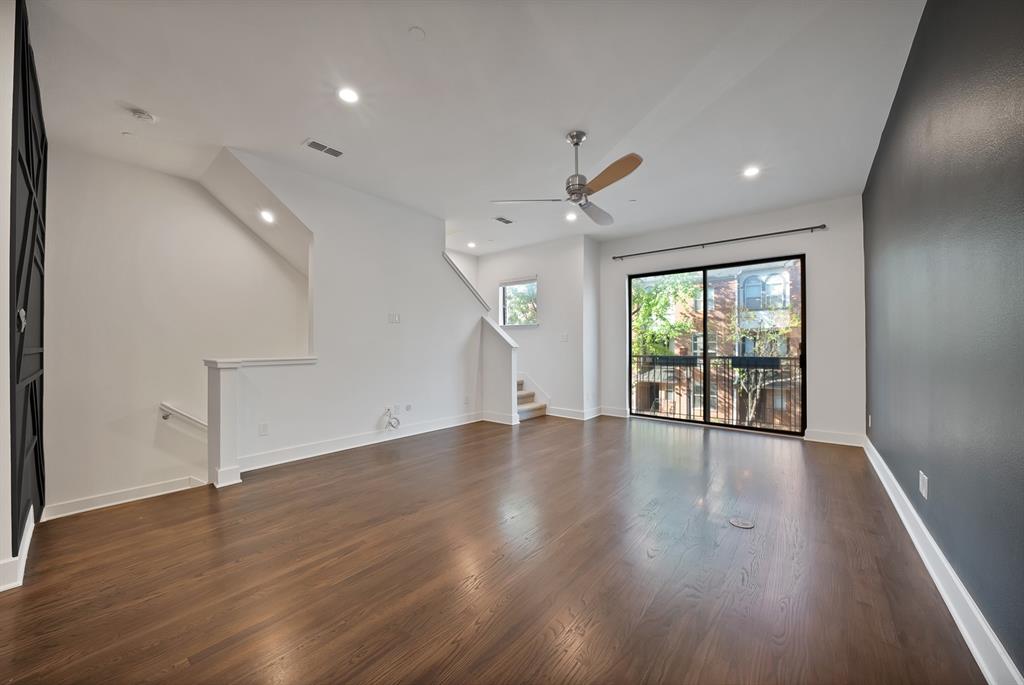 2420 Hugo Street, Unit 3 Dallas, TX 75204 - Photo 19 of 36 an empty room with wooden floor and windows