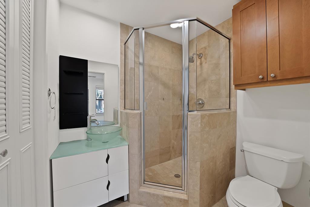 2420 Hugo Street, Unit 3 Dallas, TX 75204 - Photo 21 of 36 a bathroom with a shower and toilet