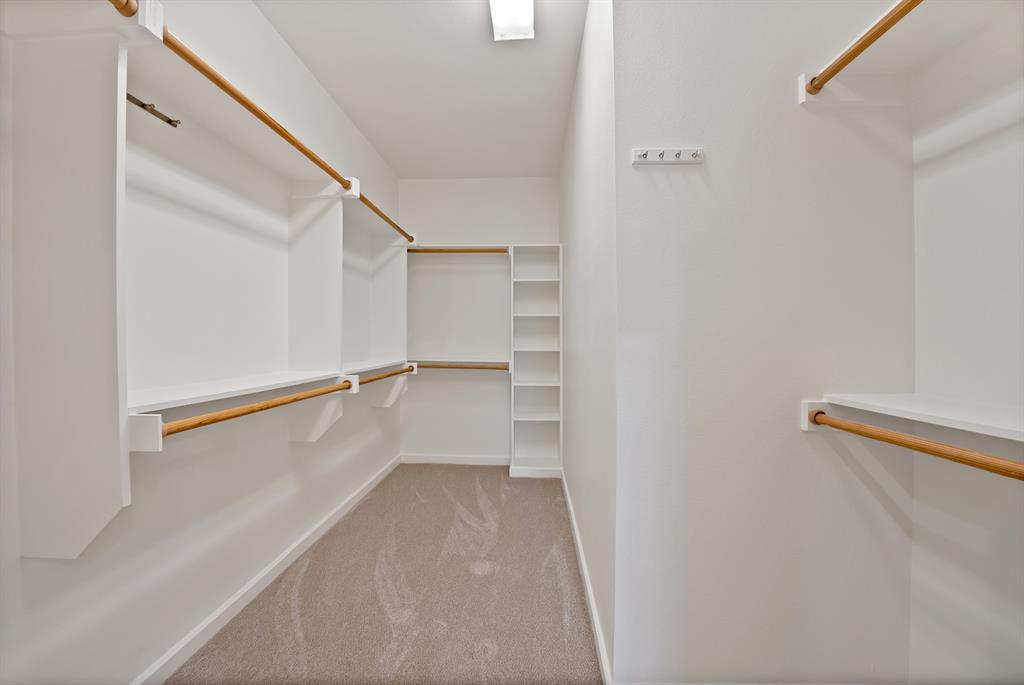 2420 Hugo Street, Unit 3 Dallas, TX 75204 - Photo 27 of 36 a view of walk in closet with empty racks