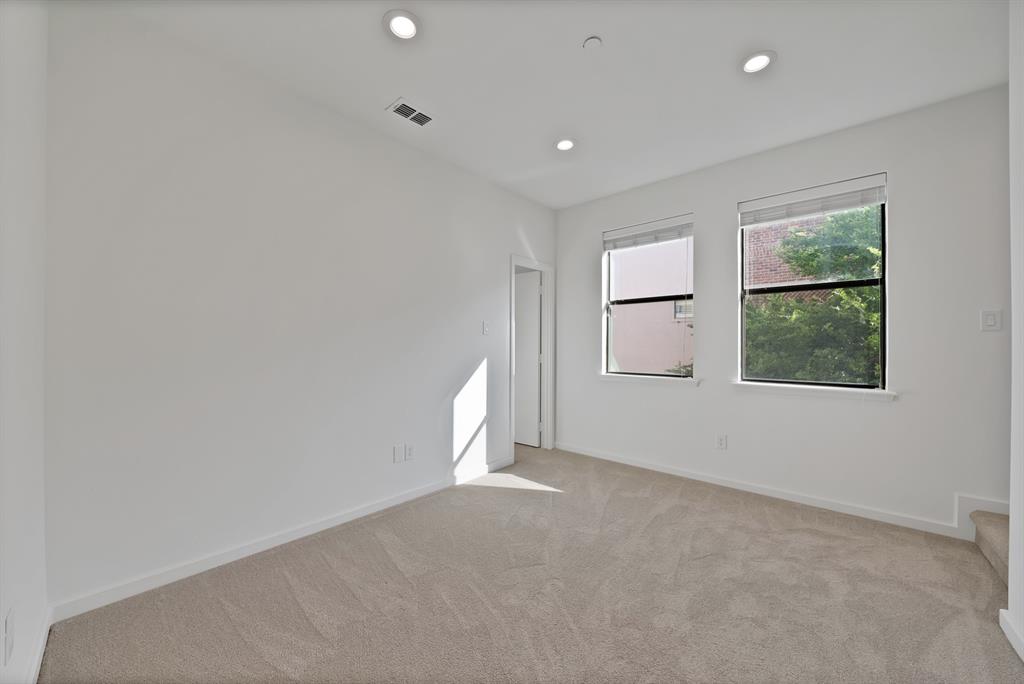 2420 Hugo Street, Unit 3 Dallas, TX 75204 - Photo 31 of 36 an empty room with windows