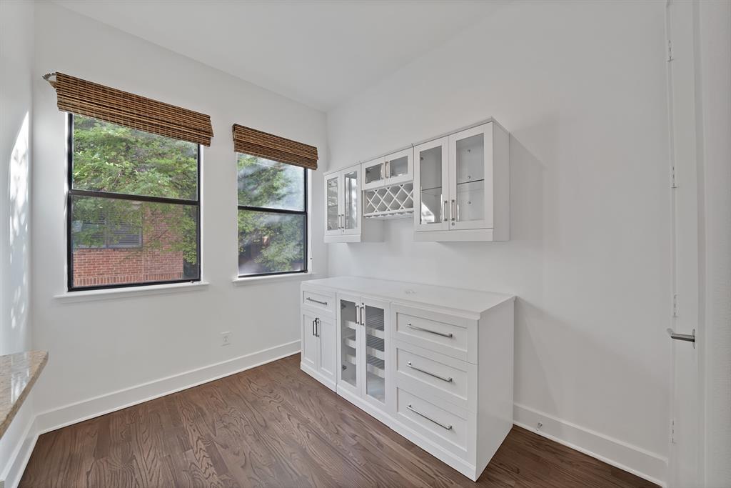 2420 Hugo Street, Unit 3 Dallas, TX 75204 - Photo 32 of 36 a hallway with windows and wooden floor