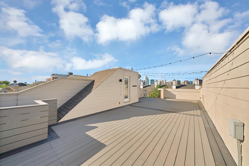 2420 Hugo Street, Unit 3 Dallas, TX 75204 - Photo 35 of 36 a view of a balcony with wooden floor