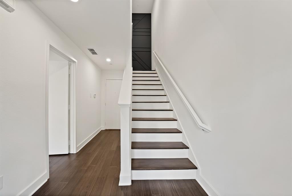 2420 Hugo Street, Unit 3 Dallas, TX 75204 - Photo 9 of 36 a view of entryway and hall with wooden floor