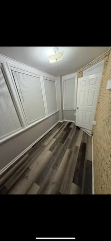 a view of a swimming pool with an outdoor seating and a yard