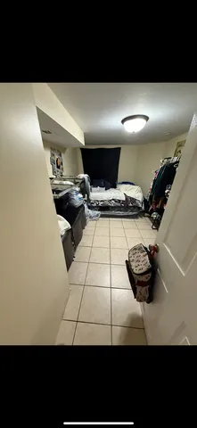 a view of gym equipment and racks