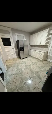 a view of washer and dryer with wooden floor