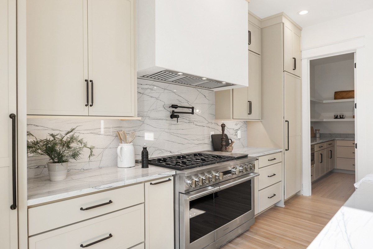 5619 Valley View Road Brentwood, TN 37027 - Photo 20 of 55 a kitchen with stainless steel appliances a stove and white cabinets