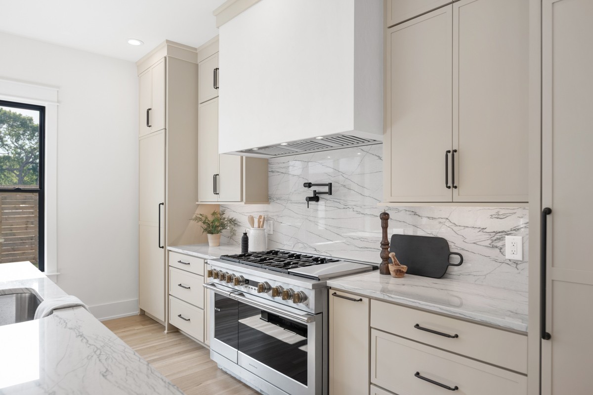 5619 Valley View Road Brentwood, TN 37027 - Photo 22 of 55 a kitchen with stainless steel appliances white cabinets and a stove