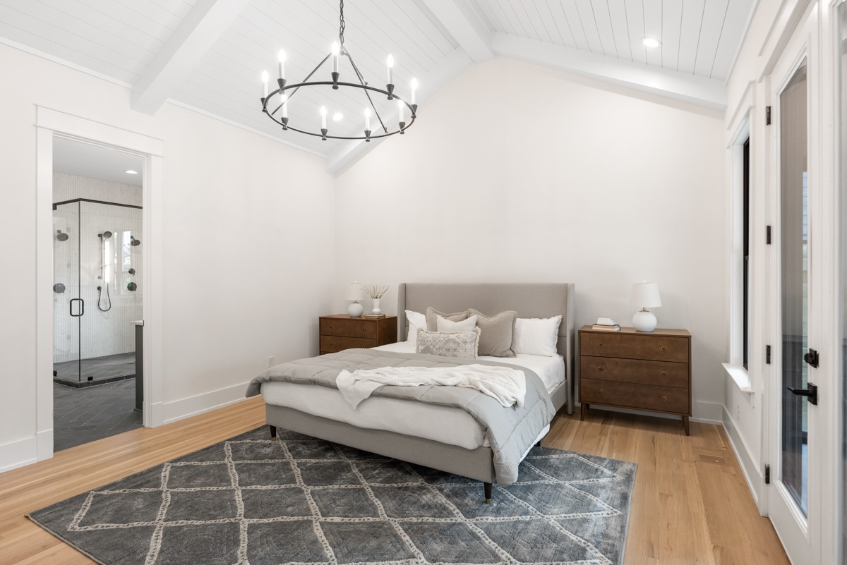 5619 Valley View Road Brentwood, TN 37027 - Photo 25 of 55 a bedroom with a bed and a chandelier