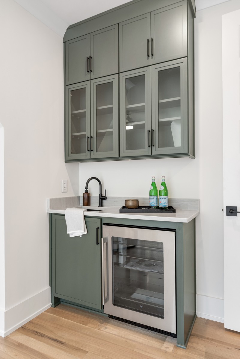 5619 Valley View Road Brentwood, TN 37027 - Photo 38 of 55 a stove top oven sitting inside of a kitchen and sink