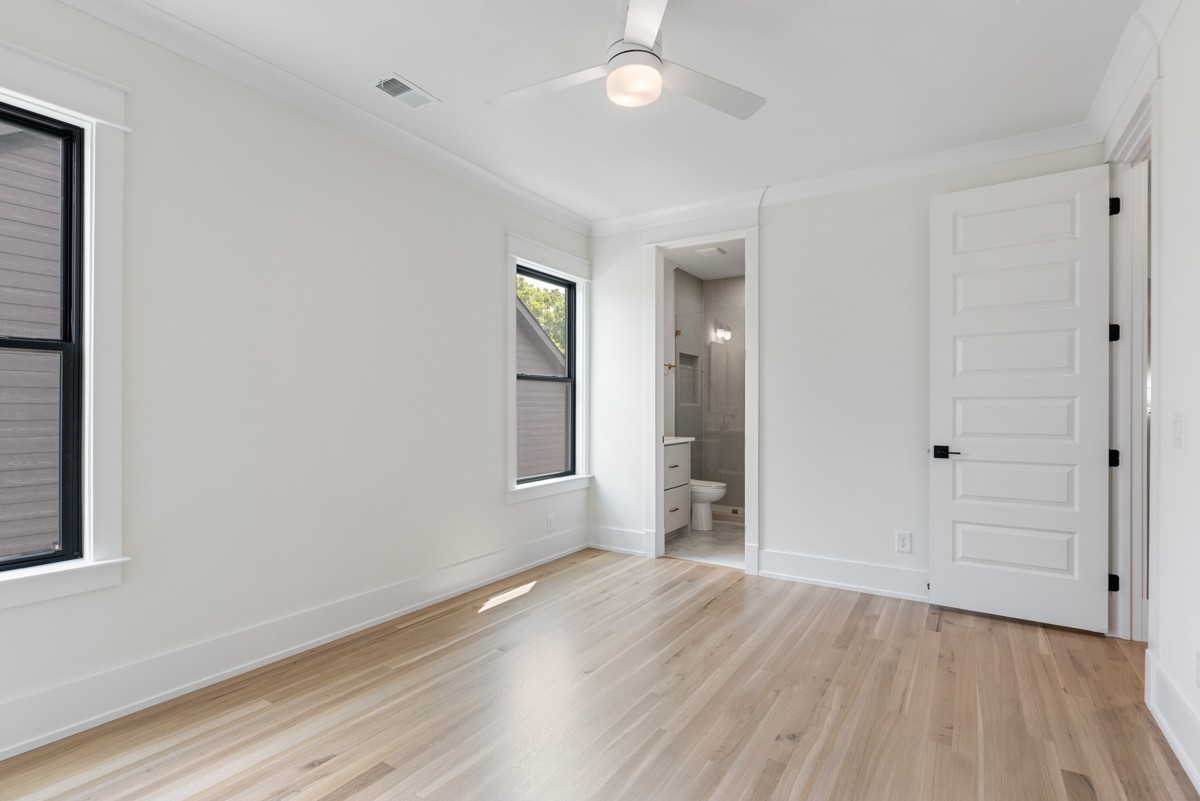 5619 Valley View Road Brentwood, TN 37027 - Photo 44 of 55 an empty room with wooden floor and windows