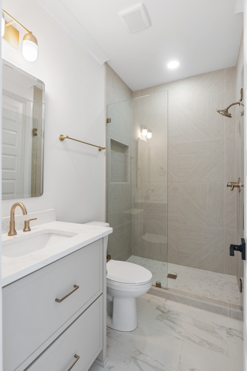 5619 Valley View Road Brentwood, TN 37027 - Photo 45 of 55 a bathroom with a sink a toilet and shower