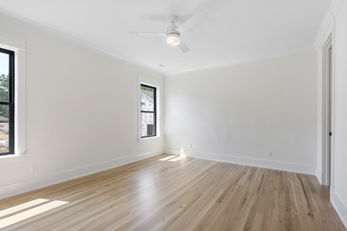5619 Valley View Road Brentwood, TN 37027 - Photo 46 of 55 an empty room with wooden floor and windows