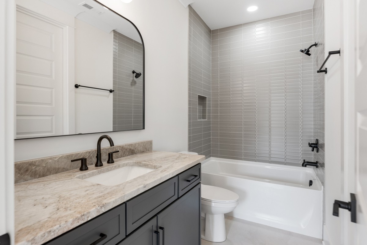 5619 Valley View Road Brentwood, TN 37027 - Photo 47 of 55 a bathroom with a granite countertop sink a toilet and shower