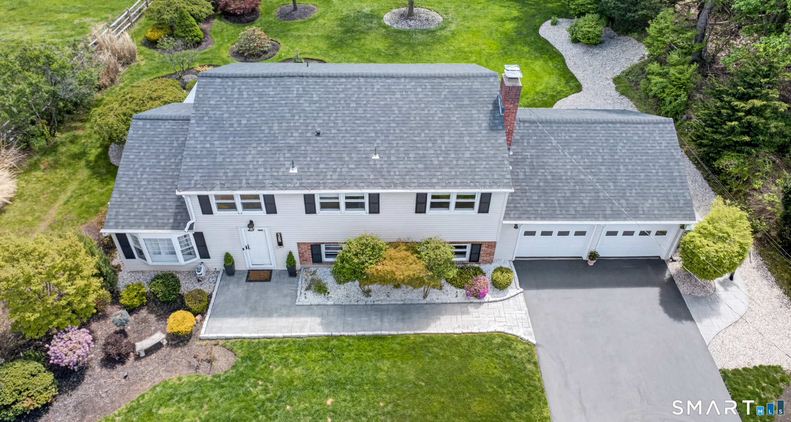 568 Wiese Road Cheshire, CT 06410 - Photo 2 of 40 an aerial view of a house with a yard and garden