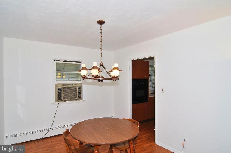 5729 Oakland Road Halethorpe, MD 21227 - Photo 13 of 18 a view of a room with a table and chandelier