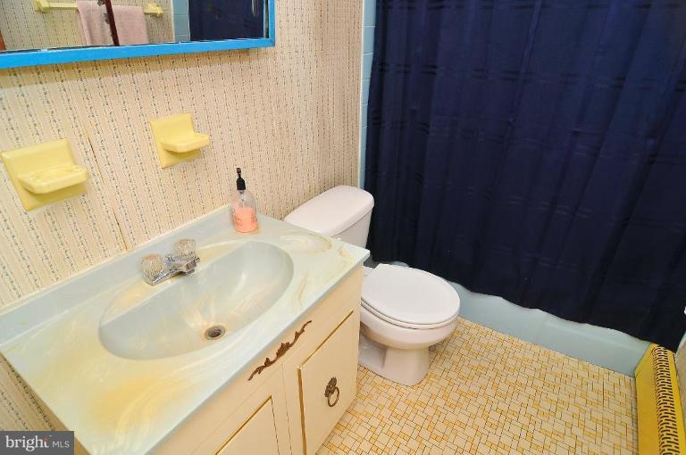 5729 Oakland Road Halethorpe, MD 21227 - Photo 3 of 18 a bathroom with a sink and a toilet